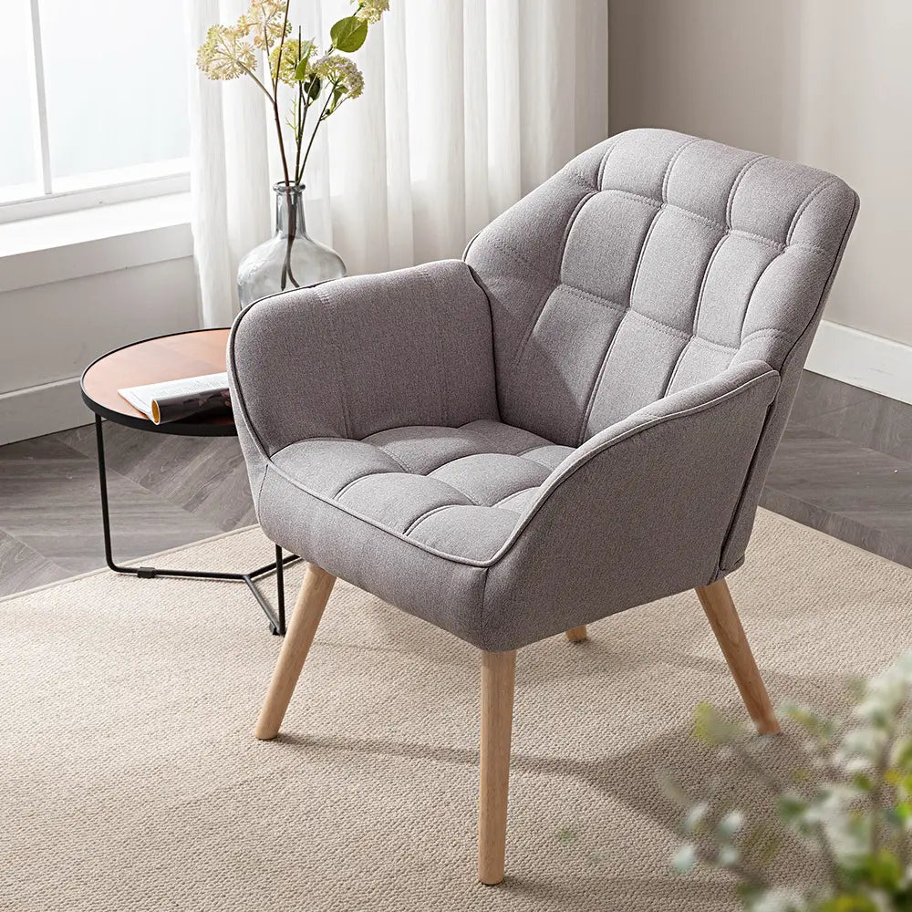 Jayna armchair with neutral-colored cushions in a cozy living room