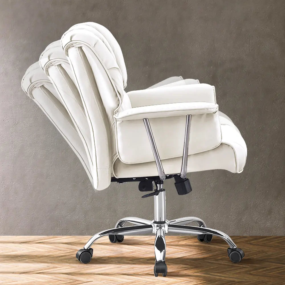 Side profile of the Travis Faux Leather Chair showing ergonomic lumbar suppor