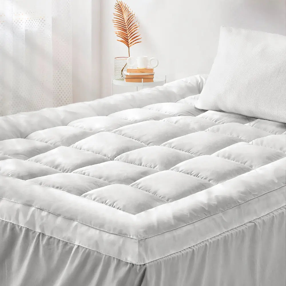Side view of the Zoilo Cotton Mattress Topper showing its plush thickness