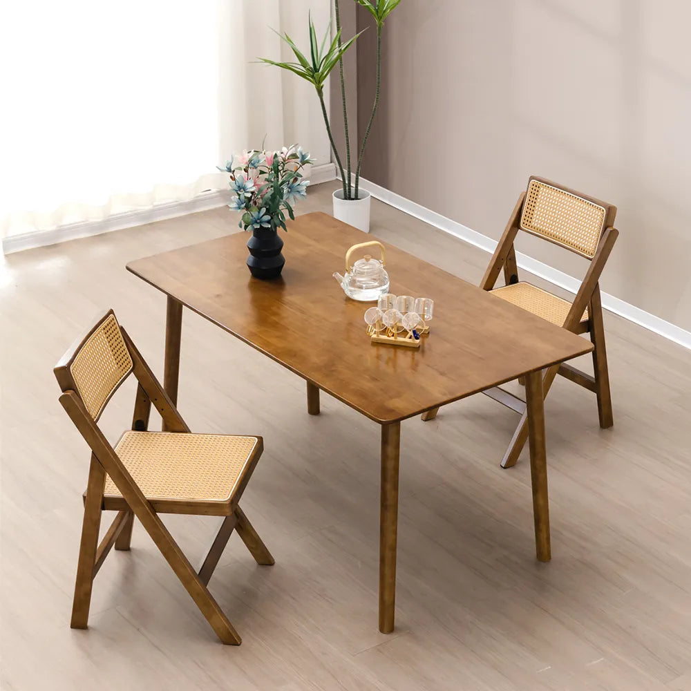 Rye Dining Chairs around a modern dining table in a sleek setting