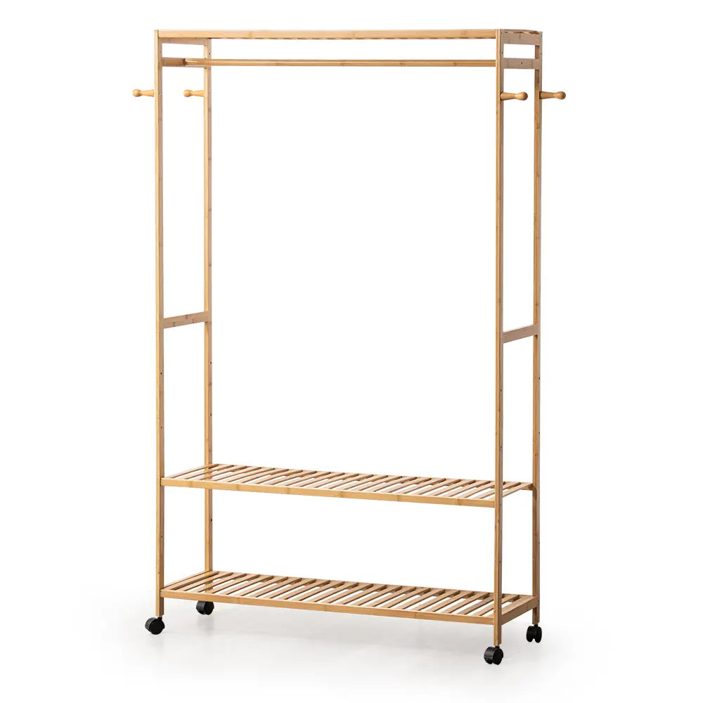 Tessa Garment Rack displaying jackets, shoes, and accessories in a stylish room