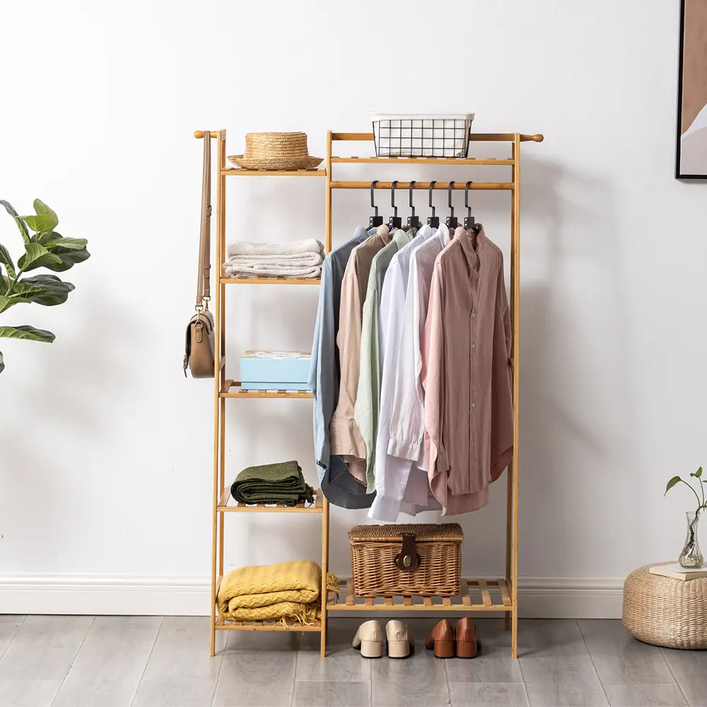 Billy Garment Rack displaying clothes in a modern room