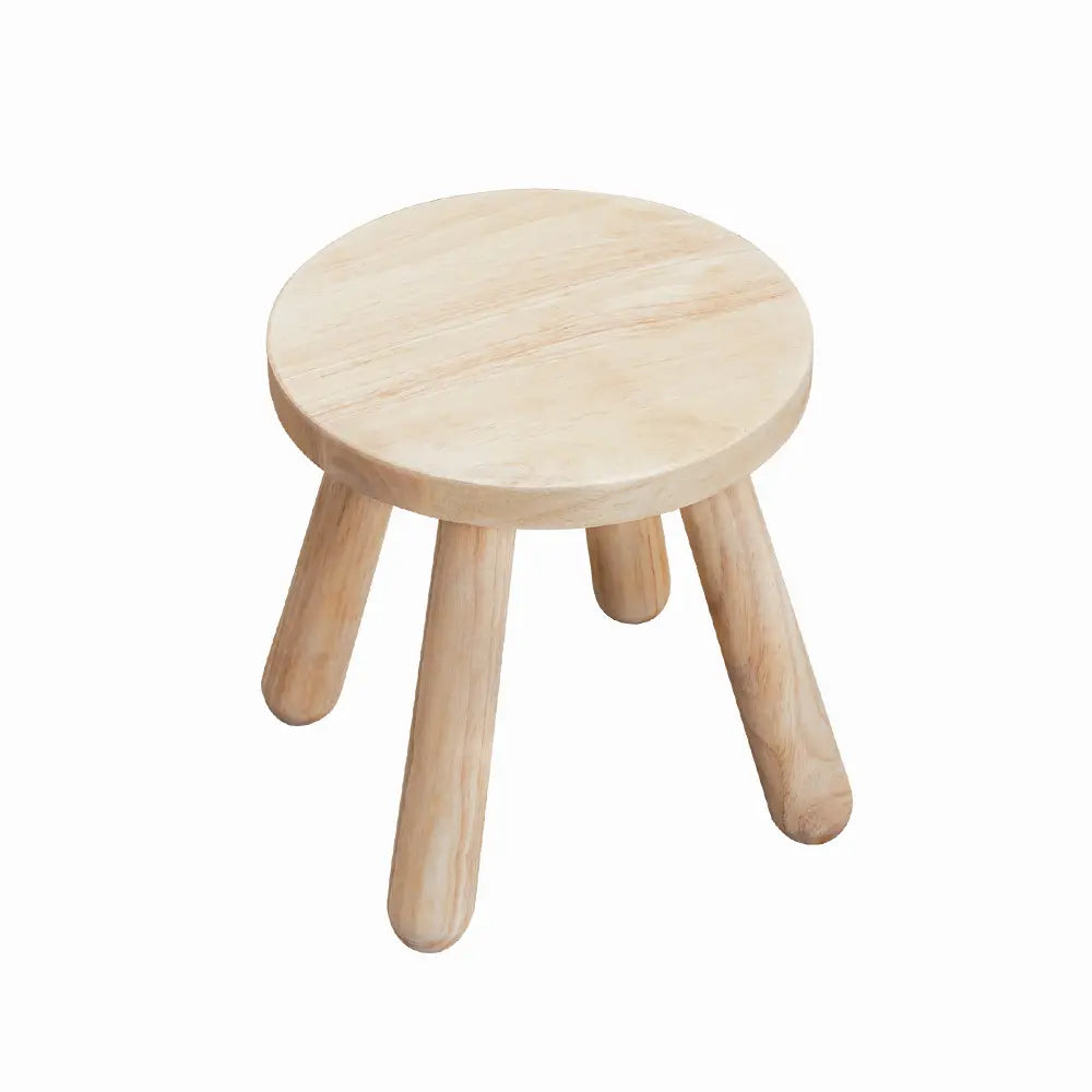 Top-down view of the Olivia Kids Stool in a bright and playful room