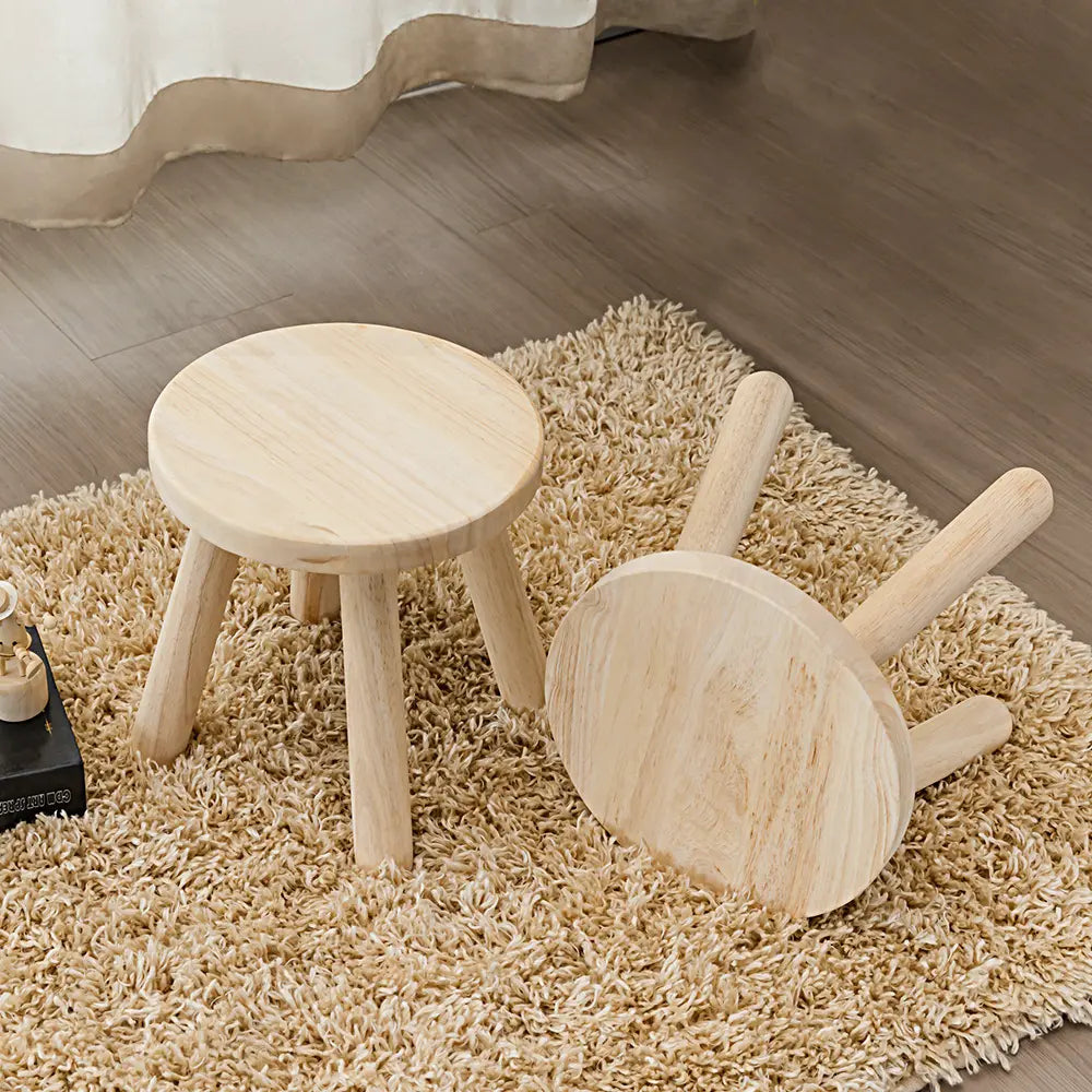 Olivia Kids Stool next to a craft table in a child’s bedroom