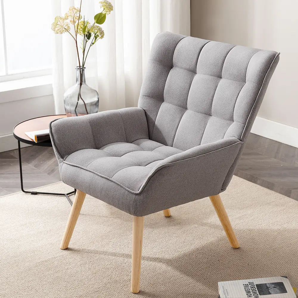 Jean armchair with neutral fabric upholstery in a cozy corner