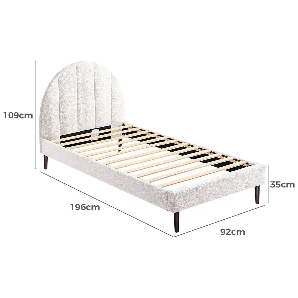 Willa Boucle Bed in a cozy bedroom with neutral-toned bedding and décor