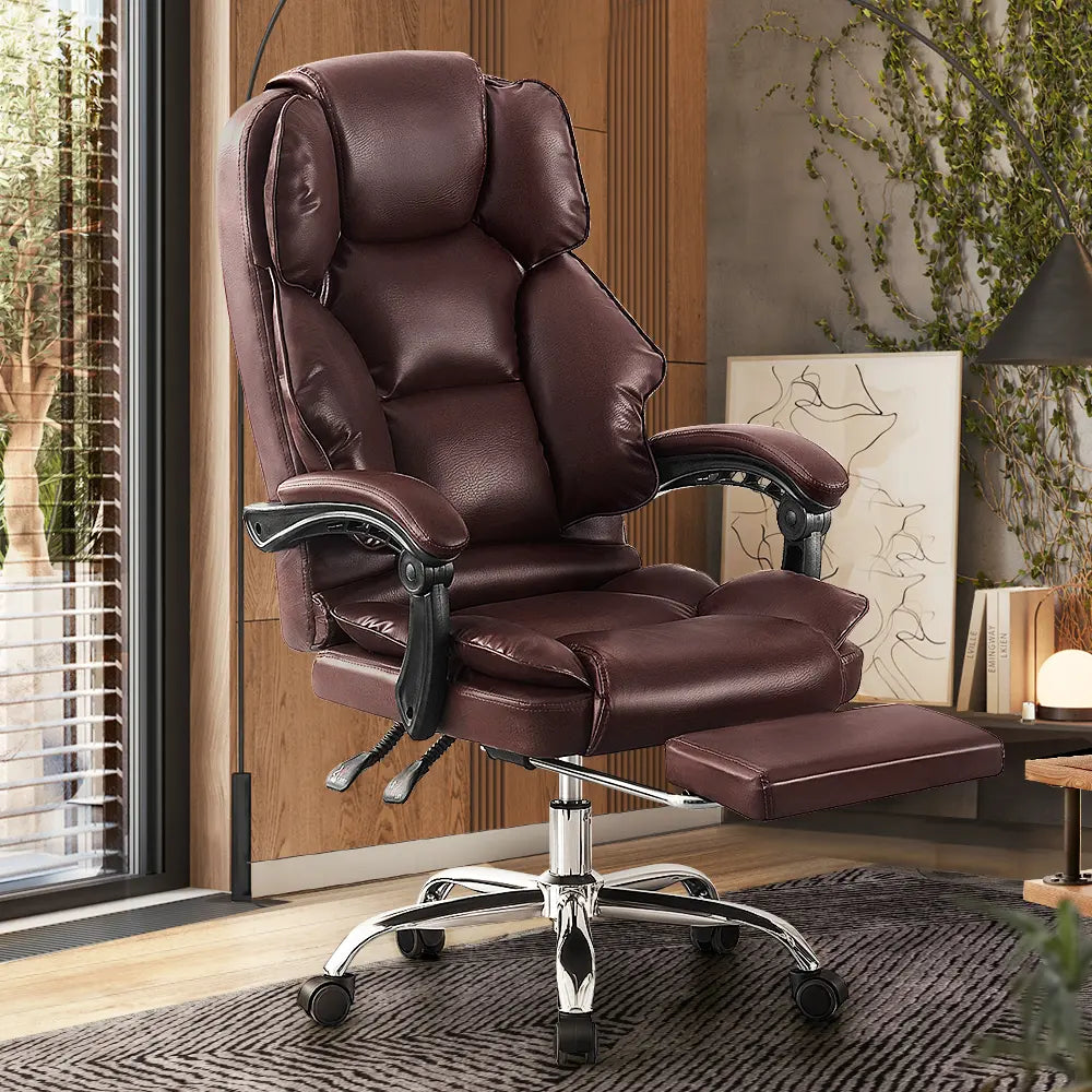 Front-facing view of the Truesdale Faux Leather Chair with adjustable armrests and footrest