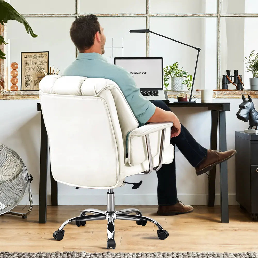 Back-facing view of the Travis Faux Leather Executive Chair with adjustable armrests