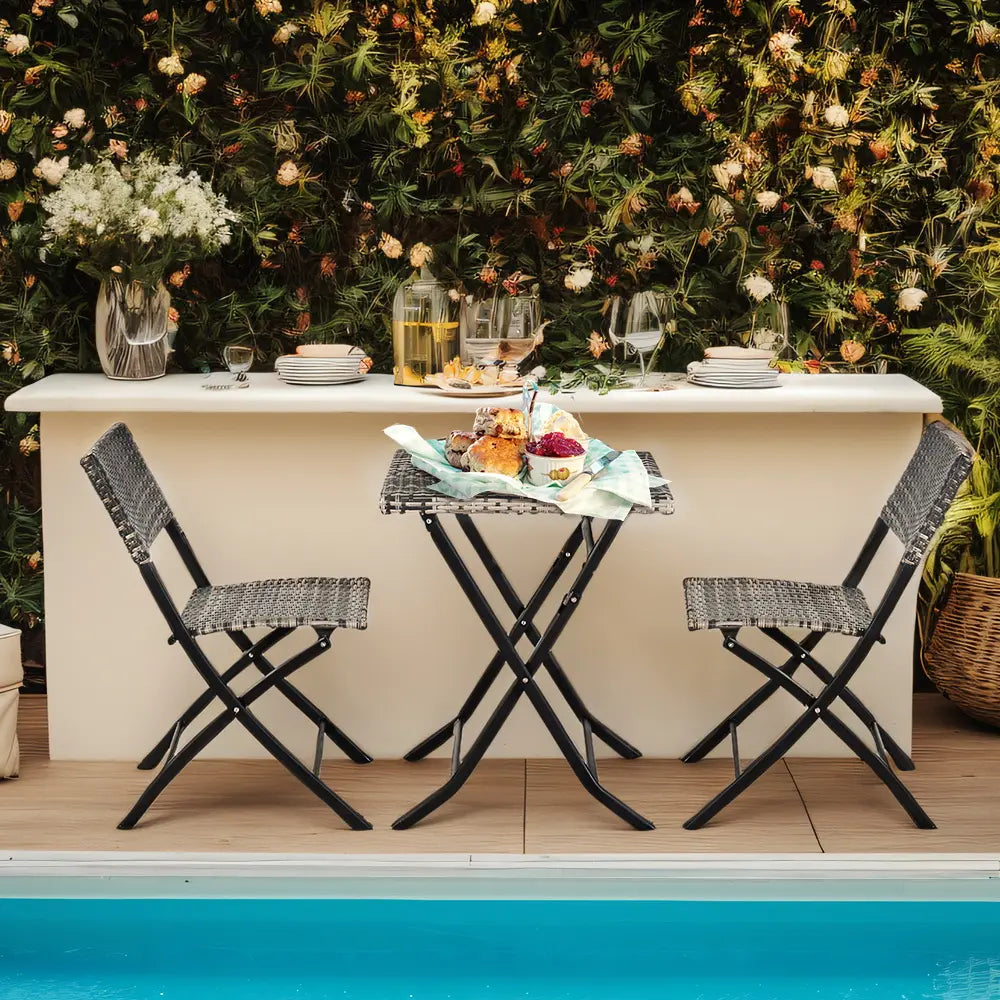 Grey Hamilton foldable dining set with chairs and table in garden