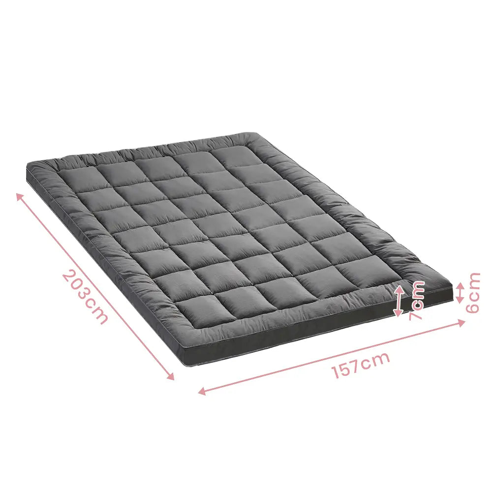 Comfortable and breathable Zoilo Mattress Topper in a bright, airy bedroom