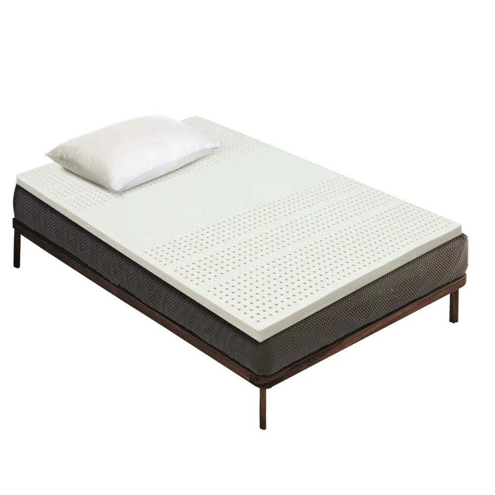 Top-down view of Lyric 50MM Organic Latex Topper in a stylish bedroom