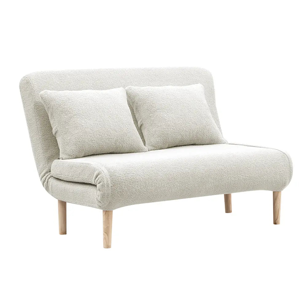 Byron sofa bed in a modern apartment, styled with decorative pillows