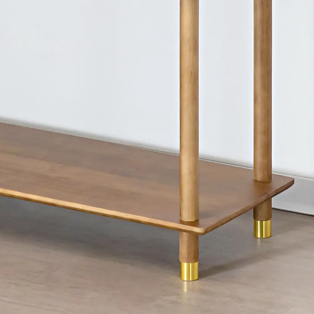 Close-up of brass feet on Esther bookshelves