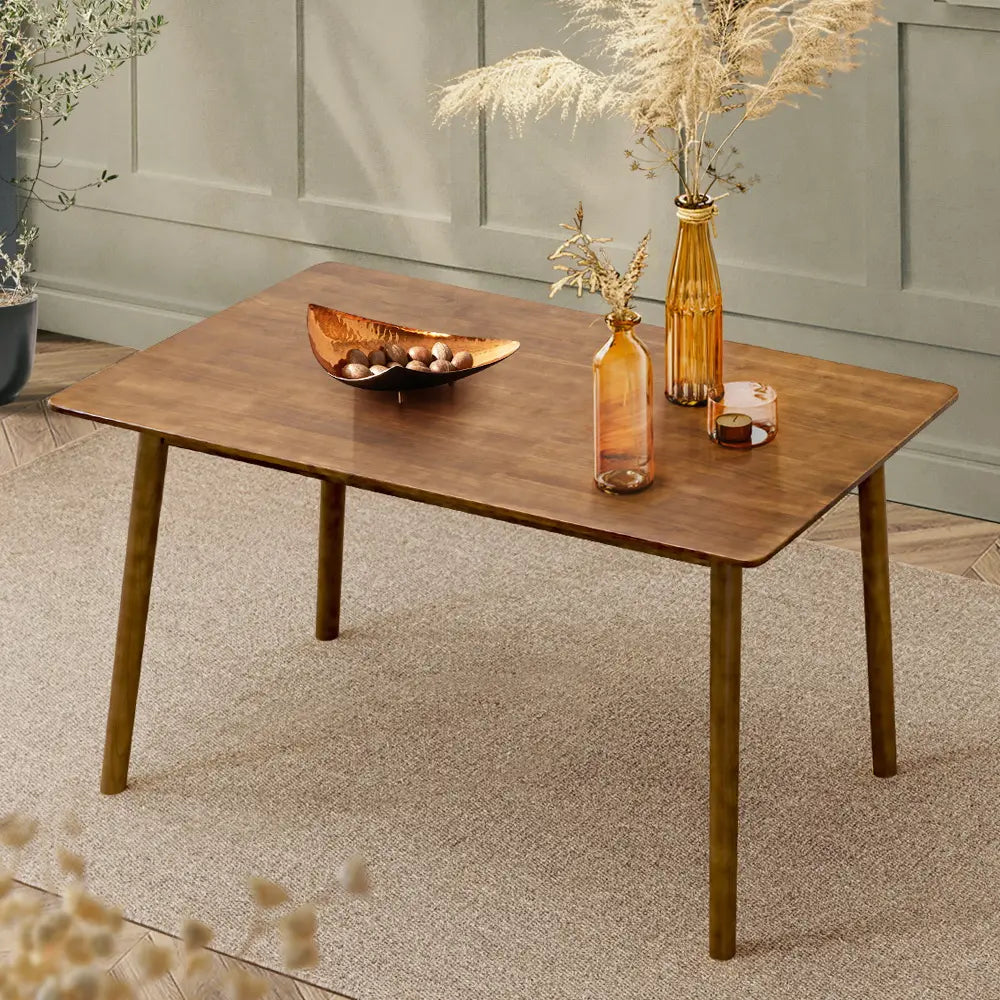 Barron wooden dining table with sleek chairs in a Scandinavian-style home